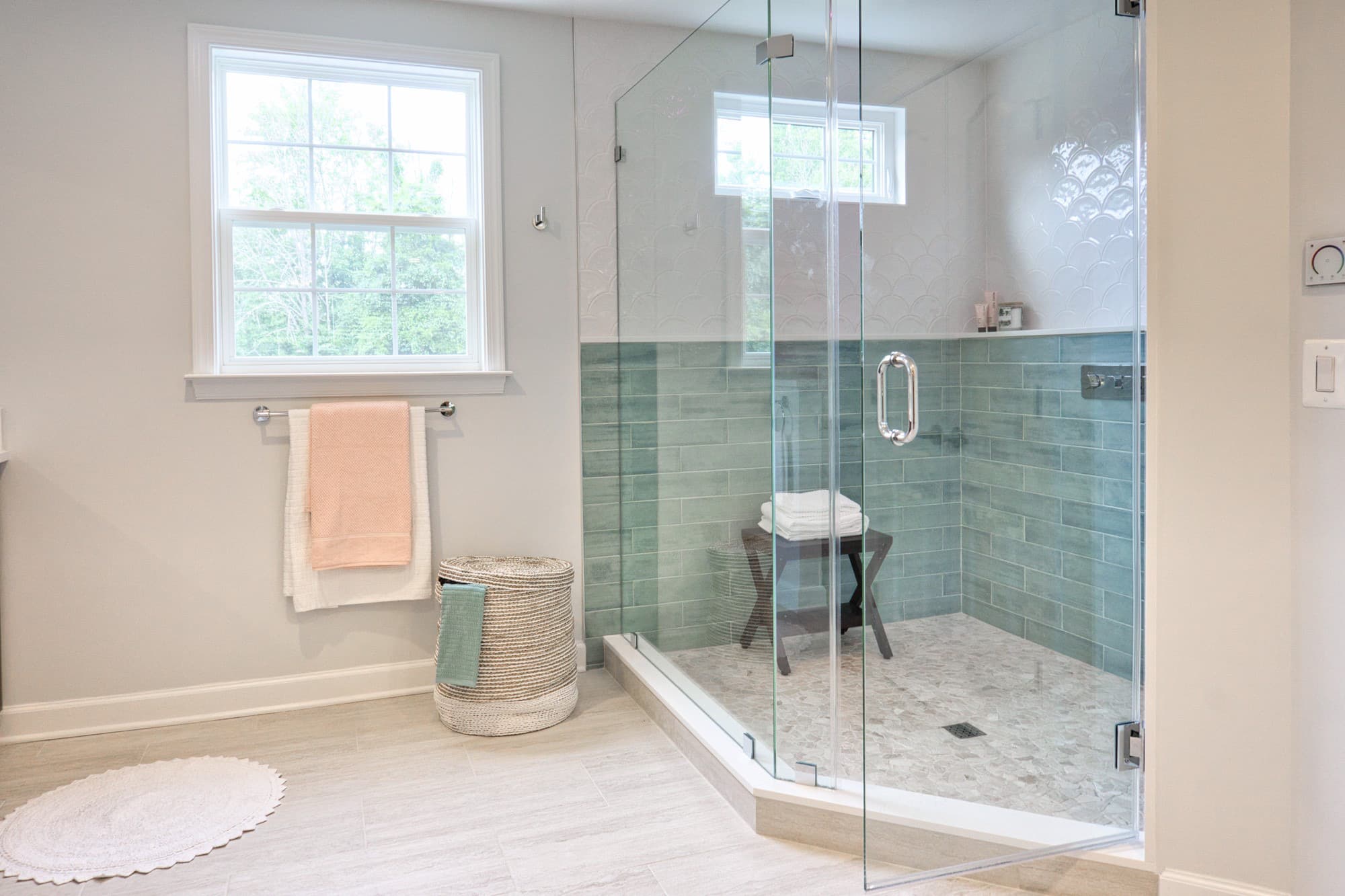 Custom frameless glass shower door with modern hardware in Cary bathroom